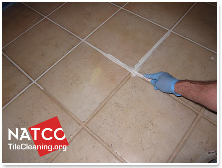 painting grout lines with toothbrush