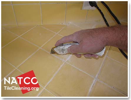removing countertop grout with utility knife